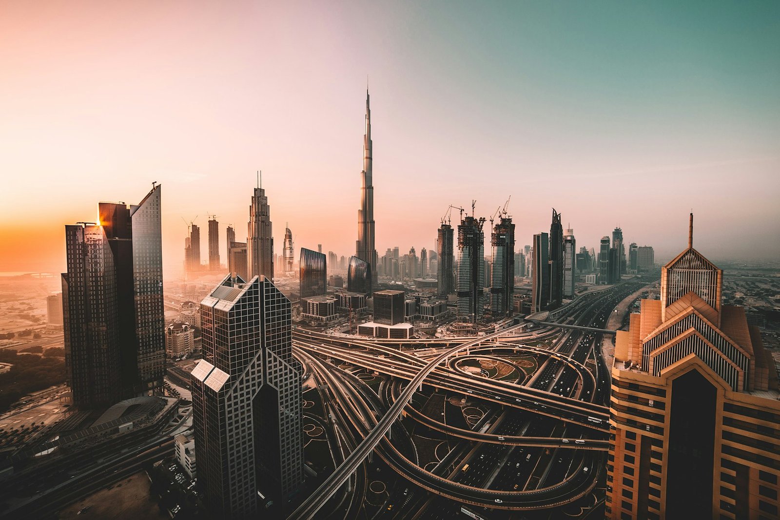 Dubai skyline emerging from low cloud at dawn